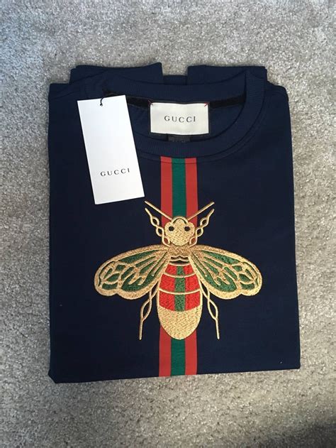 red gucci bee t shirt|Gucci bee embroidered sweater.